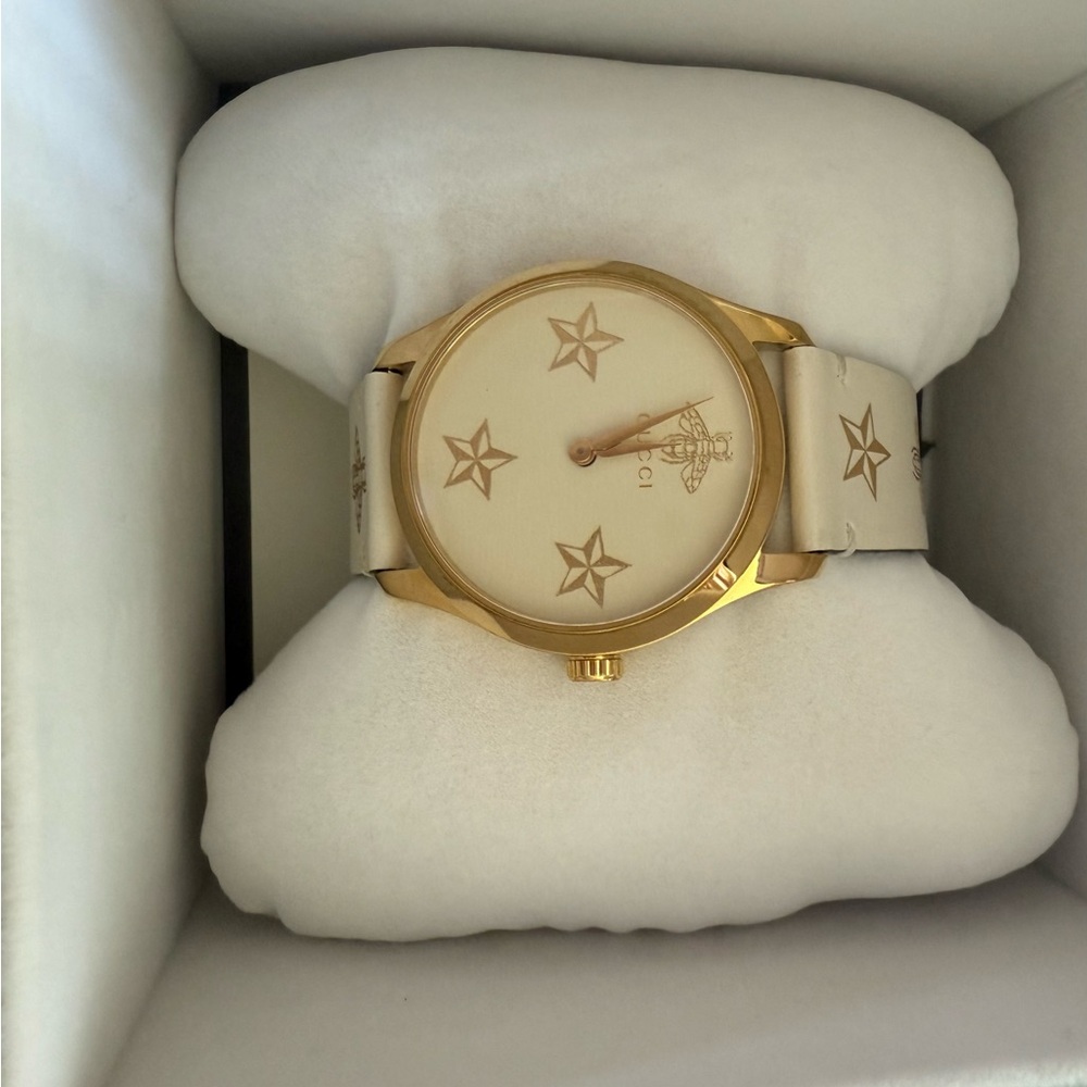 Gucci gold and cream leather brand watch